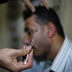 Hearing Impaired Palestinian Receives Treatment at a Bee Venom Therapy Center in Gaza City